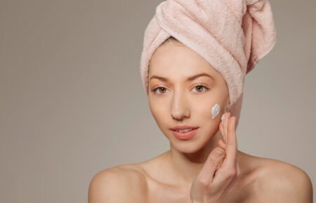 girl-with-towel-head-using-cream (1)